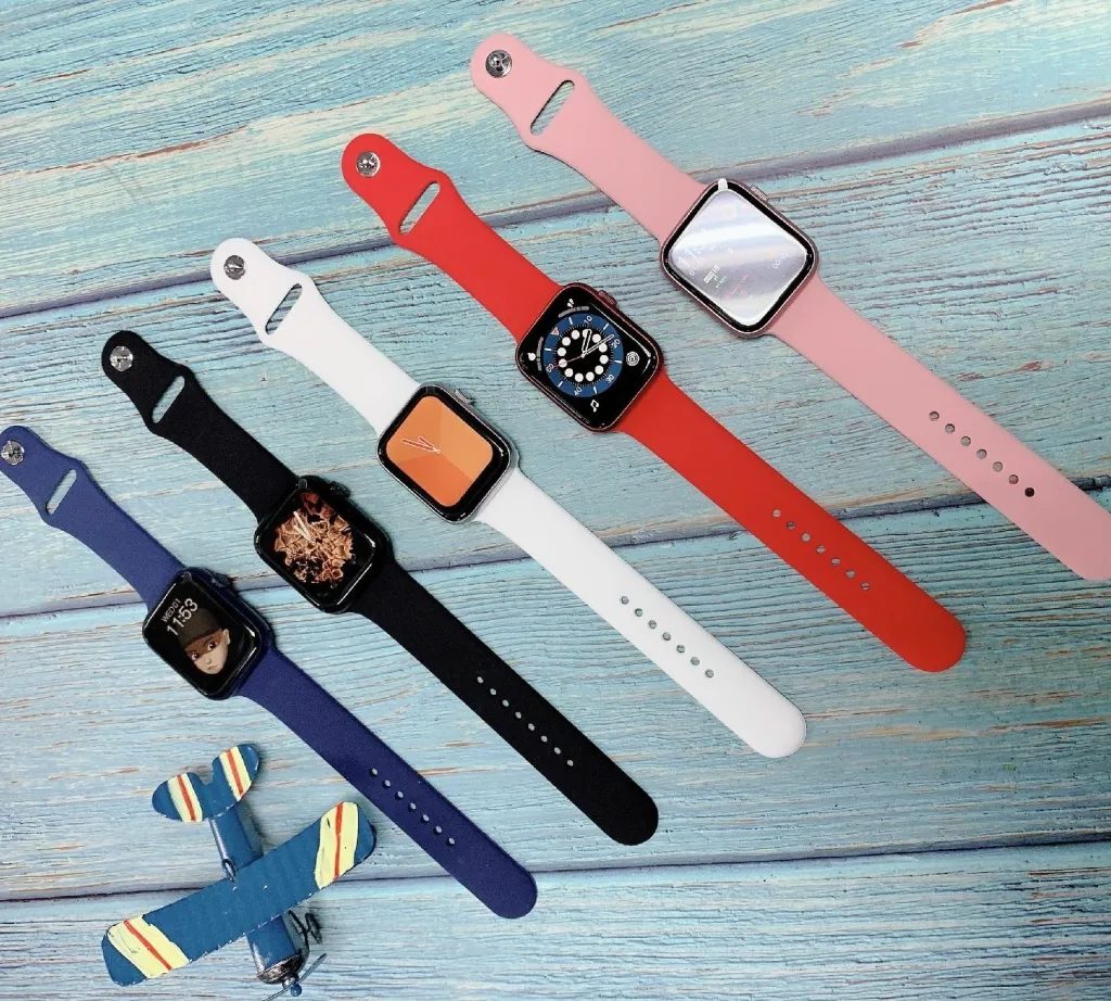 Different color smartwatches kept on a table
