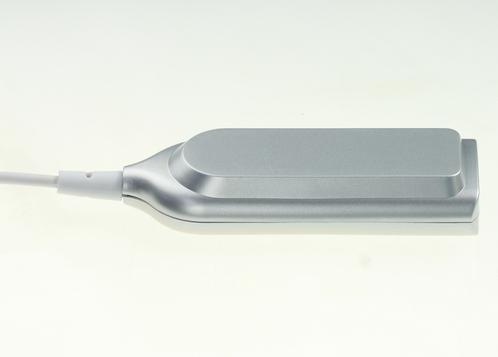 Back side of a wired USB hub with white background