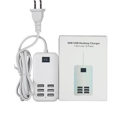 A wired white color USB hub with a box