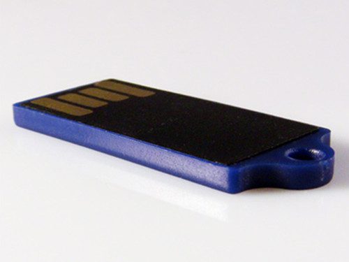 Blue and black mini USB drive on white background