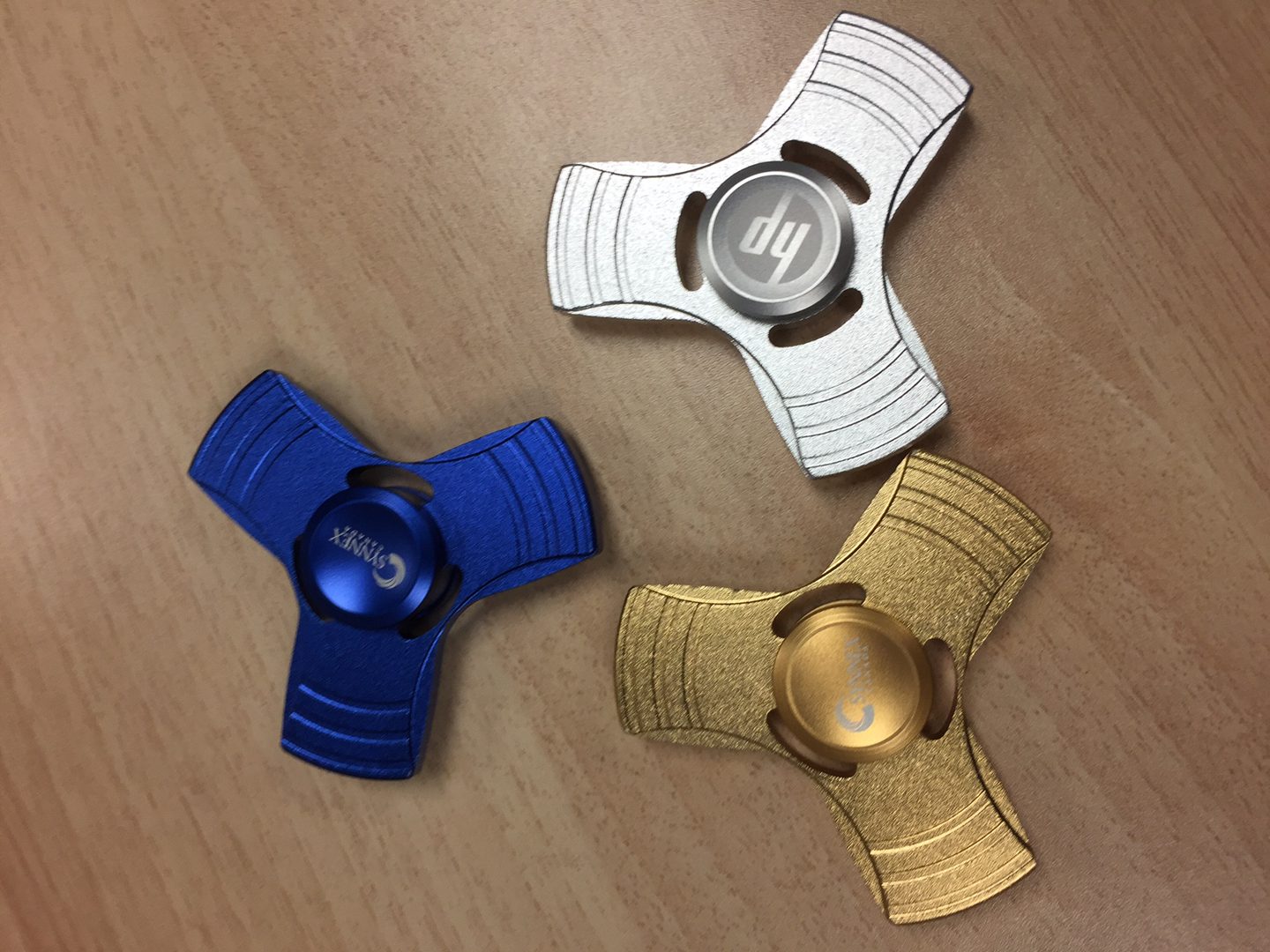 Three multicolor designer Fidget Spinners