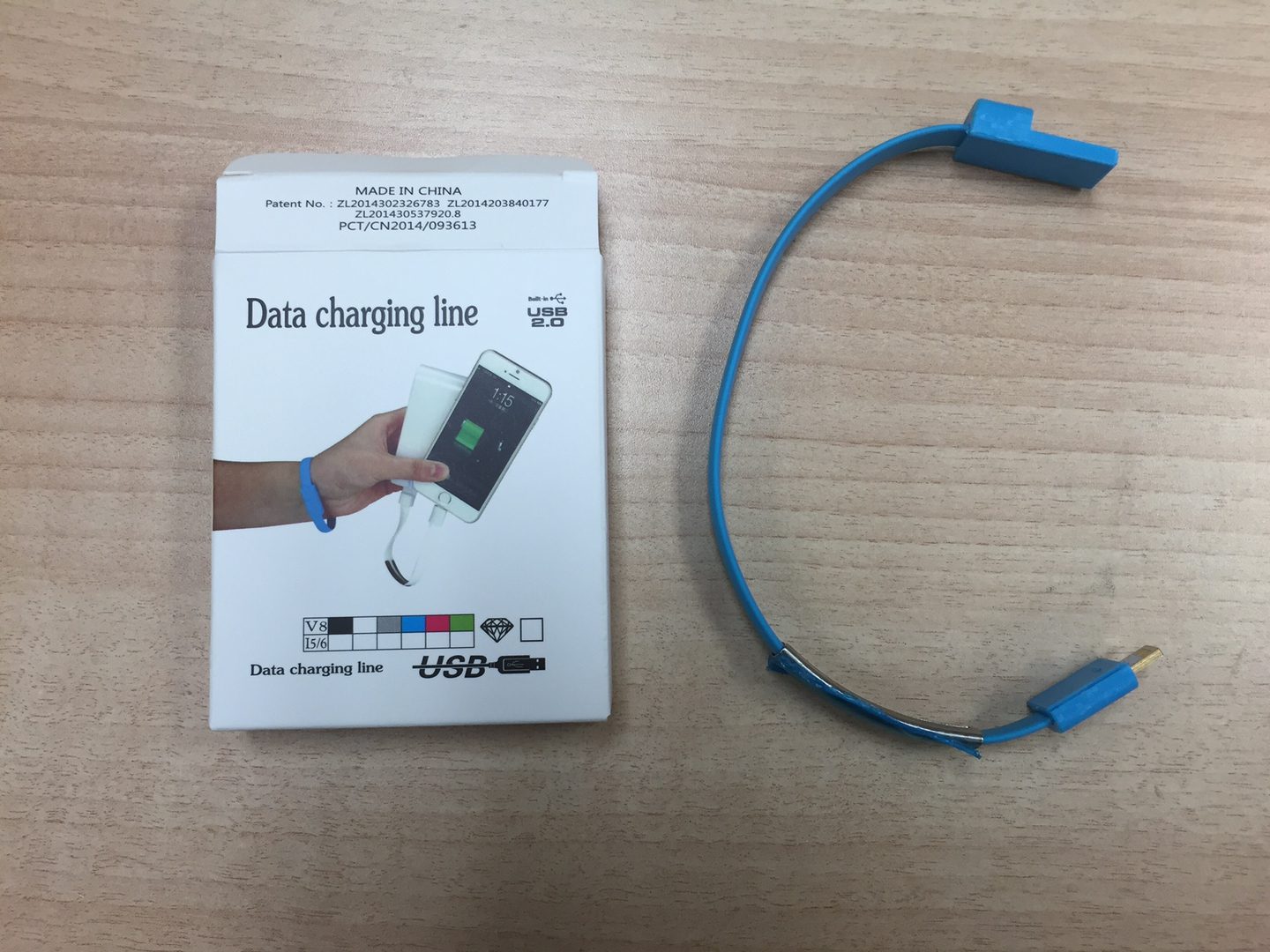 A Data Charging Line Cable in Blue With a Box