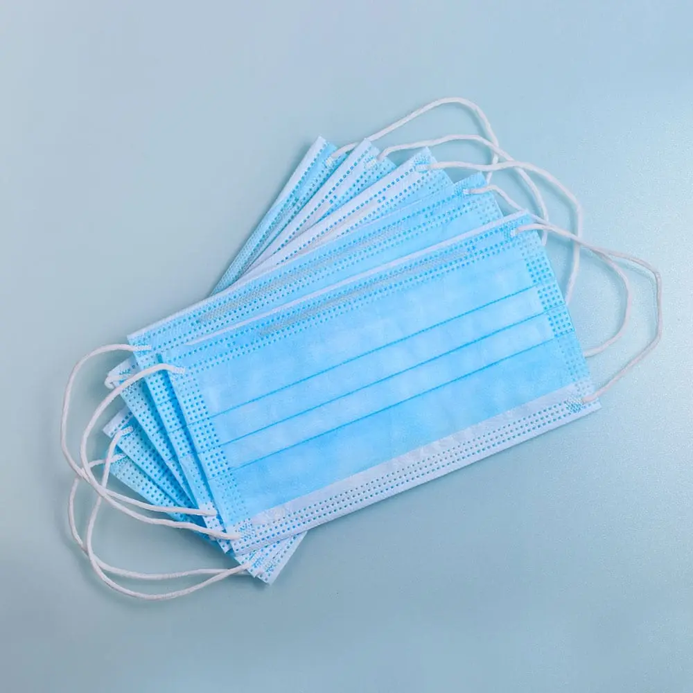 A Bunch of Disposable Masks on a Surface