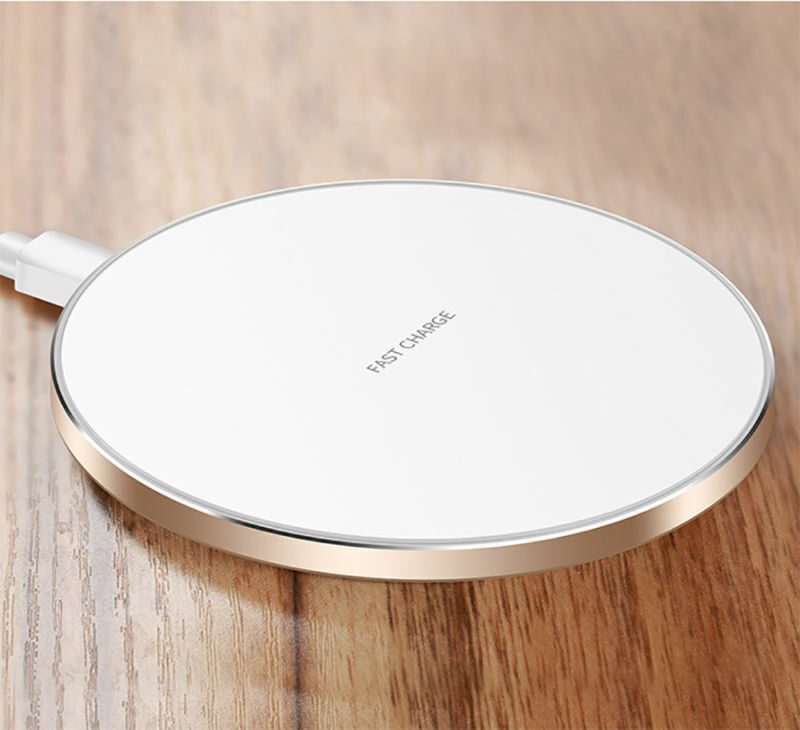 A white color wireless charger kept on a table