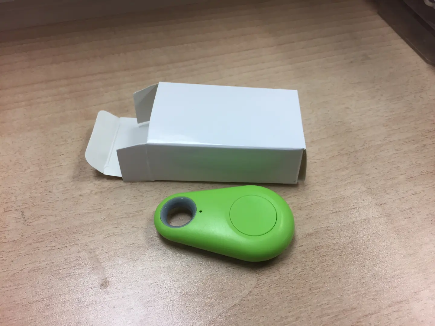 A green color key finder along with a box