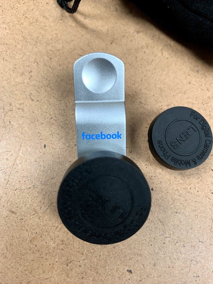 A Facebook labeled mobile lens in gray color