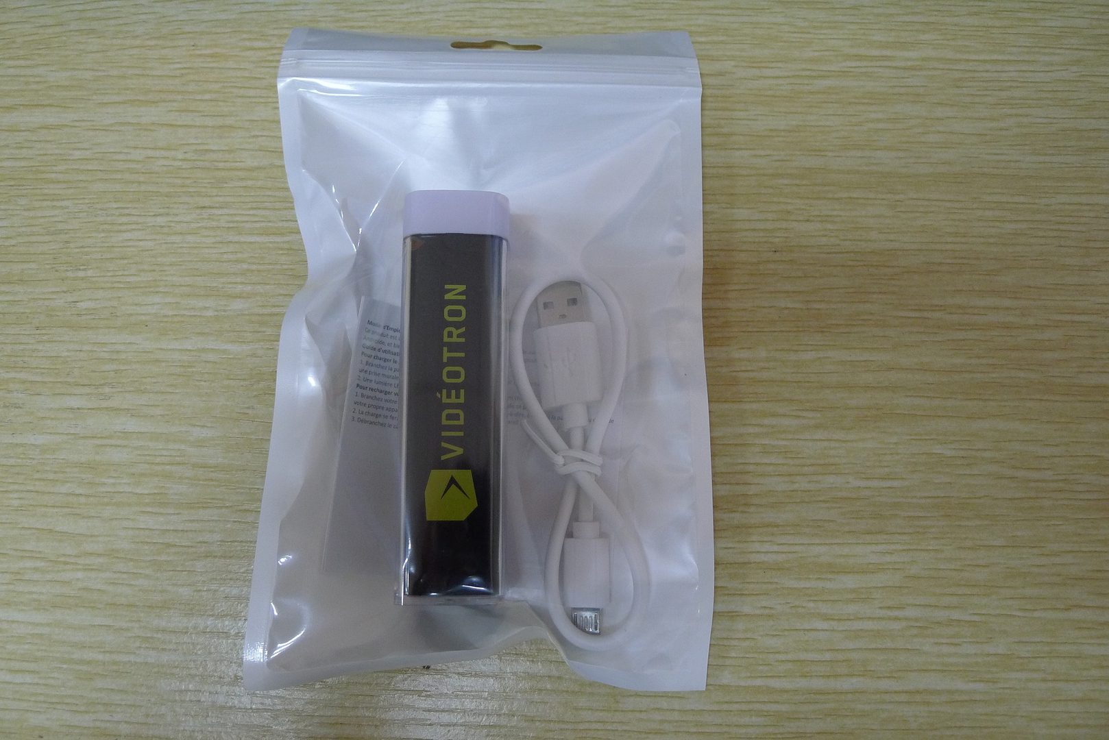 A Power Bank With a Chord Placed in a Plastic Bag