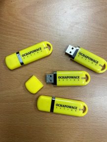 Yellow and black Plastic USB drives placed on the floor