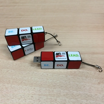 Three Rubik Cube USB drives placed on the floor
