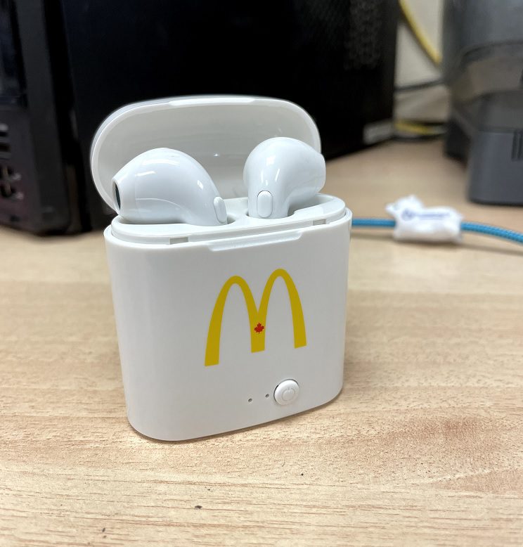 An Earbuds in White With McDonalds Sign