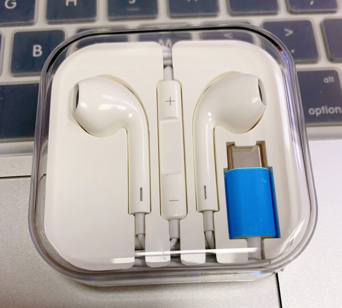 An apple earphone inside its case